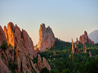 Red and orange sandstone monoliths at sunrise in Garden of the Gods Colorado Springs