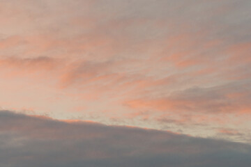 At sunset, blue sky with pink clouds. There is space for text