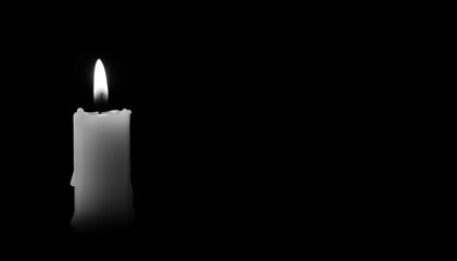 Candle burning in the black background. There's room for your text. Black and white photo. The concept of mourn, grief or mourning.