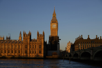 Fototapeta na wymiar Big Ben, the Elizabeth Tower, Palace of Westminster at dawn from the south bank of the river Thames, golden hour