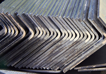 pack of steel sheets bent into an angle in a workshop