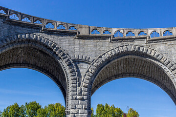 Bridge Saint-Michel. Stone vaults of the bridge. Bridge to Notre Dame de Lourdes. European...