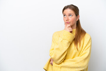 Fototapeta premium Young caucasian woman isolated on white background having doubts