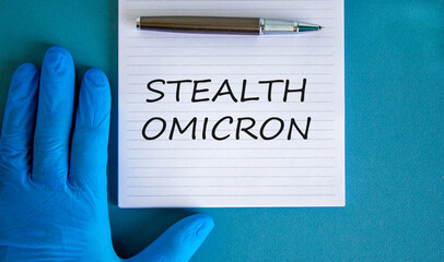 New covid-19 stealth omicron variant strain symbol. Hand in blue glove with white note. Concept...