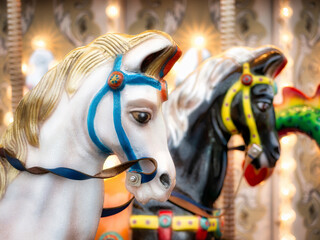 Fototapeta na wymiar Close up detail with the horses of a carousel amusement ride