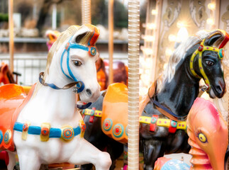 Close up detail with the horses of a carousel amusement ride