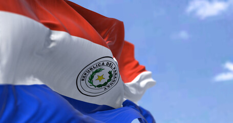 Detail of the national flag of Paraguay waving in the wind on a clear day