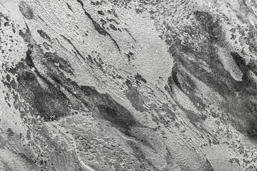 Black and white abstract stone pattern rough surface wall texture background