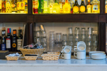 Tidy arrangement of cups and beverage at bar counter