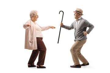 Cheerful senior man and woman dancing