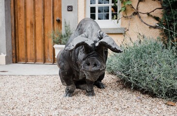 statue of a large pig outside a country home in England