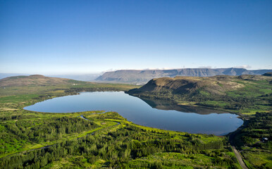 Fototapeta premium Pond in middle of mountainous valley