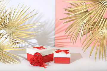 Modern creative display with stand and red heart and golden palm leaves, background. Festive mockup...