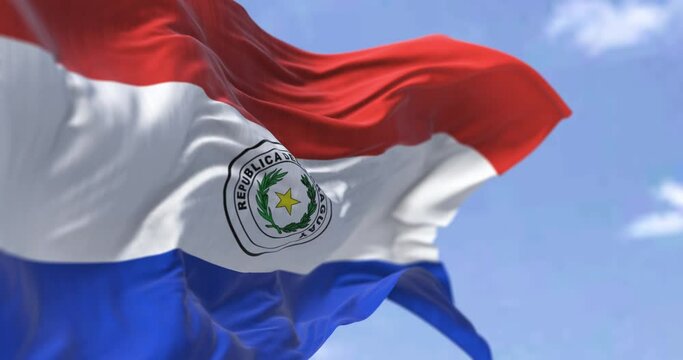 Detail of the national flag of Paraguay waving in the wind on a clear day
