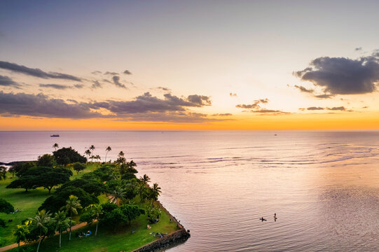 Aerial view of horizon at a golden hour sunset from Ala Moana Beach Park and Magic island in Honolulu, hawaii