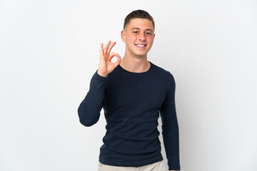 Young caucasian man isolated on white background showing ok sign with fingers