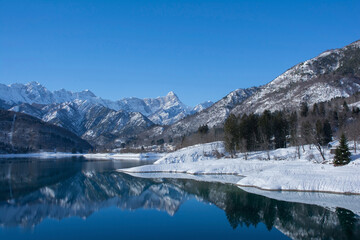 The snowy mid-December landscape at Lake Barcis in Pordenone province, Friuli-Venezia Giulia, north east Italy
