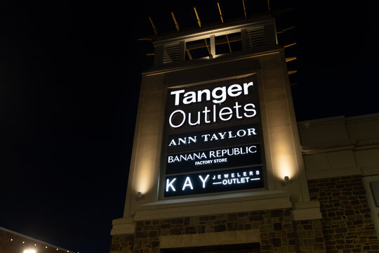 Southaven, Mississippi - January 12, 2022: Sign For Tanger Outlets, An Outdoor Discount Shopping Mall, At Night