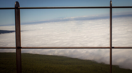 above the clouds with fence