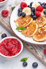 Keto diet pancakes made or almond flour, served with berries.