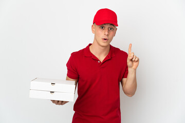 Pizza delivery man with work uniform picking up pizza boxes isolated on white background intending...