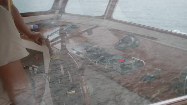 the captain turns the helm