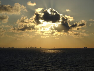 Naklejka na ściany i meble Ocean with clouds at sunset