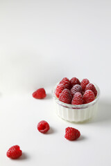 Italian dessert panna cotta with raspberries on white background.