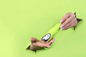 A sex toy on a green background. A place to copy. Satisfaction and relaxation for adults. Sex shop ideas