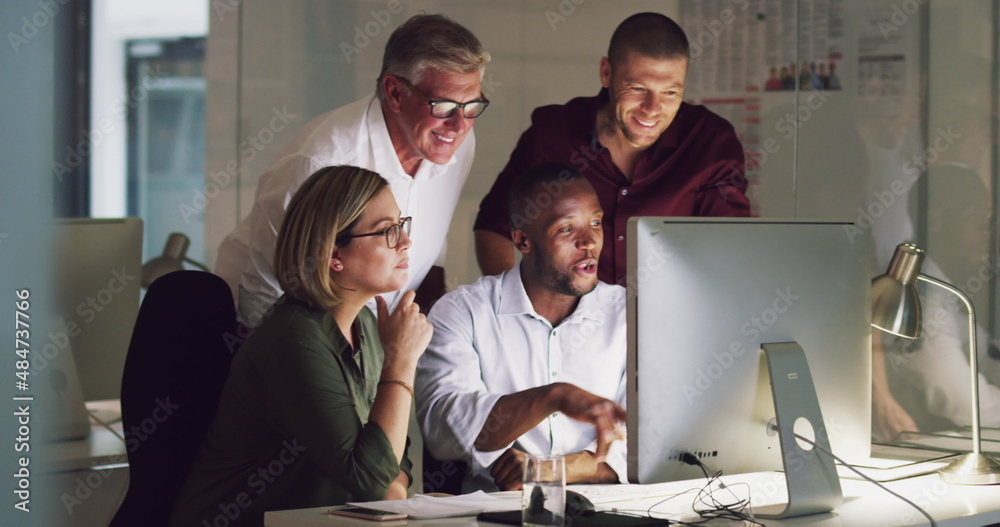 Poster Taking suggestions from the team. 4k video of a group of businesspeople working late on a computer in an office.