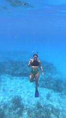 person snorkeling in a lagoon