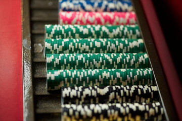 Colourful roulette chips in a casino on a gambling table. Lots of chips with different nomination and colours. multi-colored poker chips. casino chips. online casino, poker, gambling. Gaming table