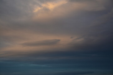 Obraz premium Beautiful morning cloudy sky with a blue tint. Sunrise in the clouds