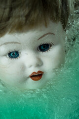 Porcelain Doll Head in Blue Green Liquid