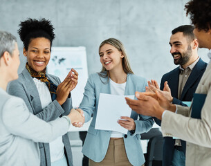 young business people meeting office handshake hand shake shaking hands teamwork group contract agreement black happy smiling success corporate applause applauding woman - Powered by Adobe