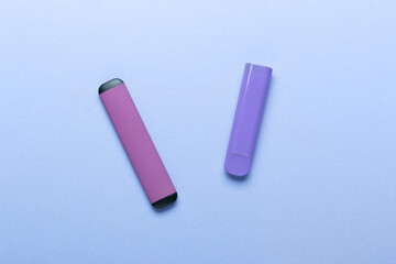 Electronic cigarettes on colored backgrounds