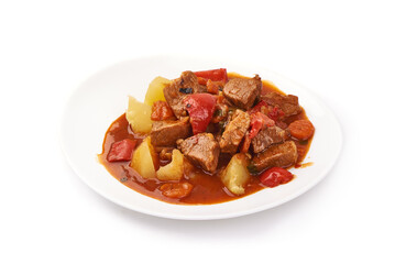 Hungarian goulash, beef, pork stew with potatoes, isolated on white background.
