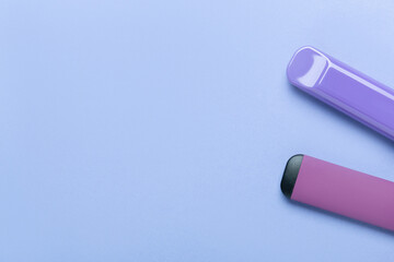 Electronic cigarettes on colored backgrounds