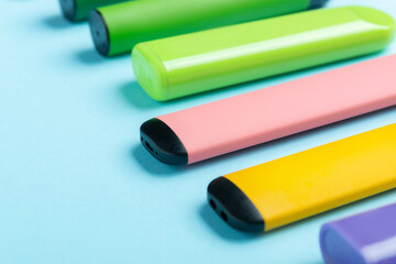 Electronic cigarettes on colored backgrounds