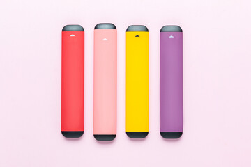 Electronic cigarettes on colored backgrounds