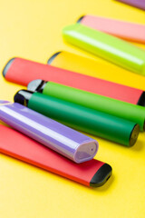 Electronic cigarettes on colored backgrounds