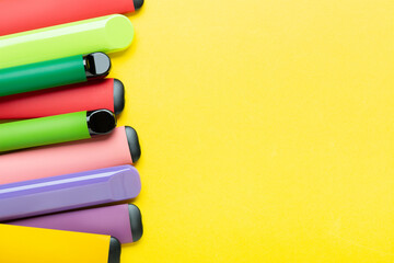 Electronic cigarettes on colored backgrounds