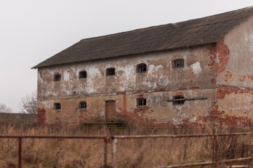 Fototapeta na wymiar Abandoned haunted distillery next to an old palace in Poland 