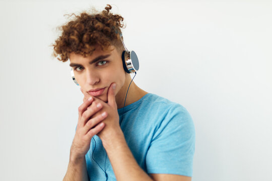 handsome young man music technology entertainment isolated background