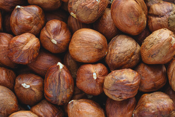 Super close up brown hazel nut on wooden desk. Healthy organic vegetarian snack hazelnut. Background
