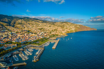 Naklejka na ściany i meble Aerial view of Funchal city center panorama in Madeira island in the evening