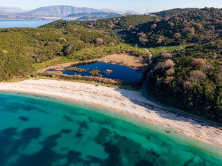 Aerial drone view of famous avlaki beach with with crystal clear water in corfu island greece
