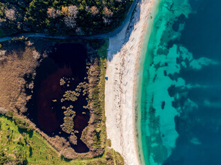 Aerial drone view of famous avlaki beach with with crystal clear water in corfu island greece
