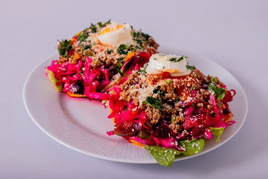 Enchilada Guatemalteca set on a white plate and white background