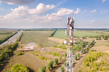 Cell site of telephone tower with 5G base station transceiver. Aerial view of telecommunication...